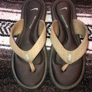 Brown Nike flip flops